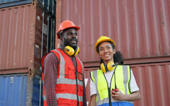 worker with cargo containers Foreman control Industrial Container Cargo freight ship at industry. Transportation and logistic.